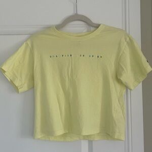 pastel yellow cropped champion tee with embroidered lettering